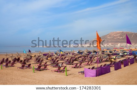 Agadir sand beach, Morocco.The inscription on the mountain - God, King, Country