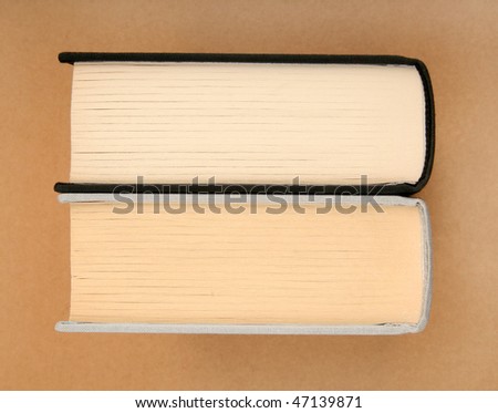 Two books on recycled cardboard background