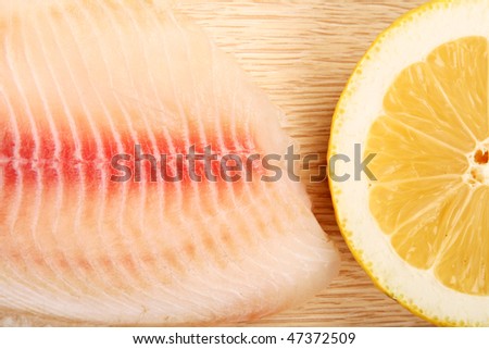 Tilapia ( lake fish like a carp) and lemon