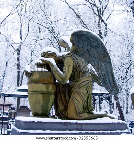 Statue of weeping angel, necropolis of Donskoy monastery, Moscow, Russia
