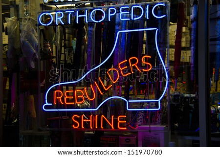Orthopedic shoes neon sign in a Manhattan shoe repair store window