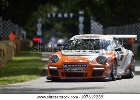 GOODWOOD, UK - JULY 1: The Porsche 911 GT3 Cup Car drives up the hill at the Festival of Speed hill course at Goodwood, UK on July 1, 2012
