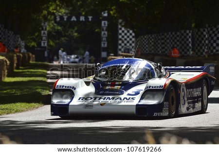 GOODWOOD, UK - JULY 1: The Porsche 956 Le Mans race car drives up the Festival of Speed hill course at Goodwood, UK on July 1, 2012