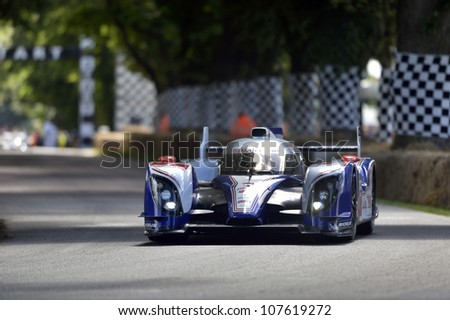 GOODWOOD, UK - JULY 1: The Toyota TS030 HV-R race car drives up the Festival of Speed hill course at Goodwood, UK on July 1, 2012