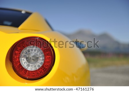 stock photo Yellow sports car light detail