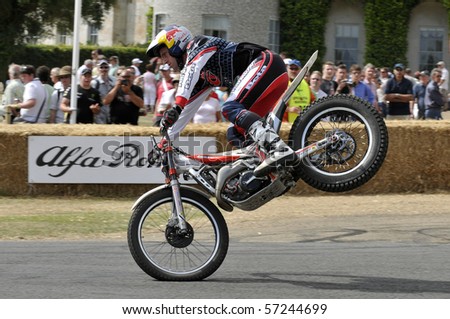 GOODWOOD, UNITED KINGDOM - JULY 3: World Champion trials rider Dougie Lampkin rides up the hill at the Goodwood Festival of Speed in the United Kingdom on July 3, 2010 in Goodwood, UK