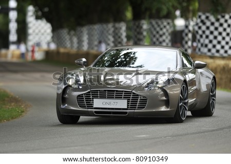 GOODWOOD, UNITED KINGDOM - JULY 1: The new and exclusive Aston Martin One-77 drives up the hill at the Goodwood Festival of Speed in the United Kingdom on July 1, 2011 in Goodwood, UK
