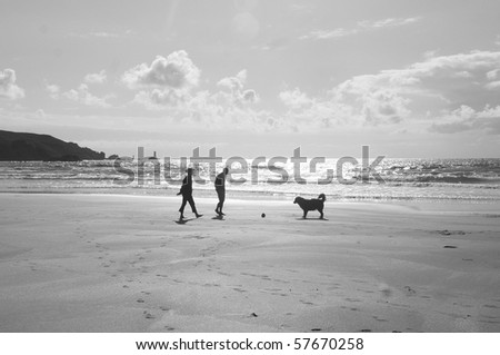 Walking with dog by atlantic ocean
