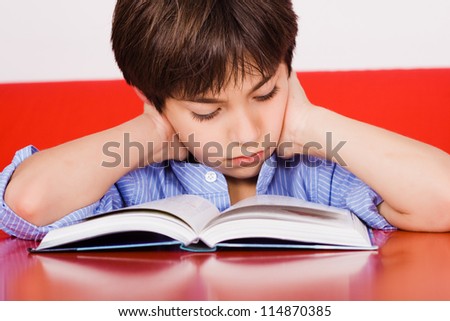 Kid Reading A Book