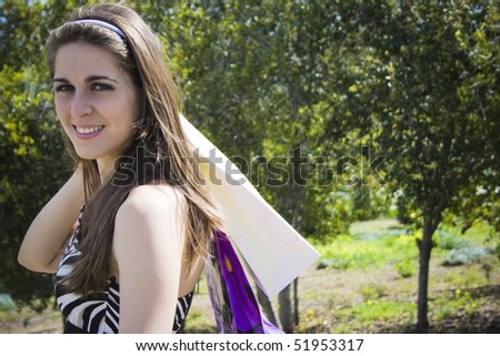 portrait of girl with chestnut colored shoulder bags
