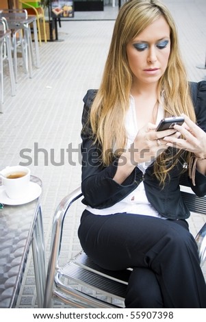 Young girl business, reading a message by phone