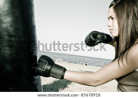beautiful young woman with boxing gloves