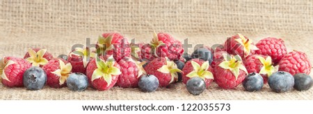 bilberries and raspberries on sacking vintage cloth