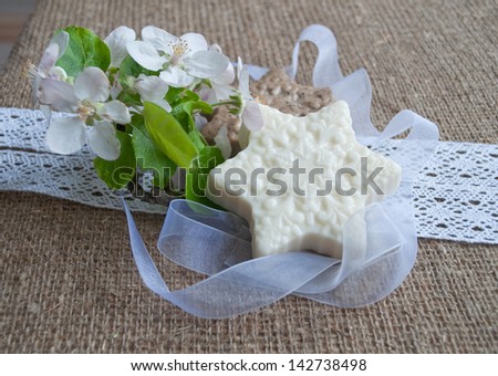 handmade soap with flowers on sacking cloth