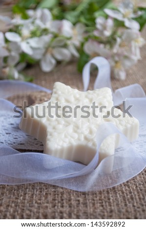 bars of soap with flowers on sacking cloth