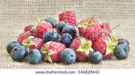 bilberries and  raspberries on sacking vintage cloth