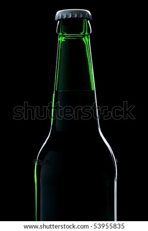 beer bottle close-up over black background