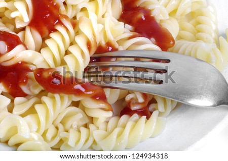 Bowl of pasta in a tomato sauce.