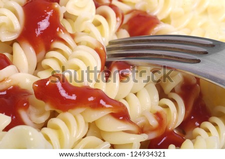 Bowl of pasta in a tomato sauce.
