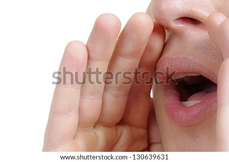 Man shouting loud with hands on the mouth