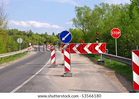 stock-photo-road-work-detour-and-road-construction-signs-53566180.jpg