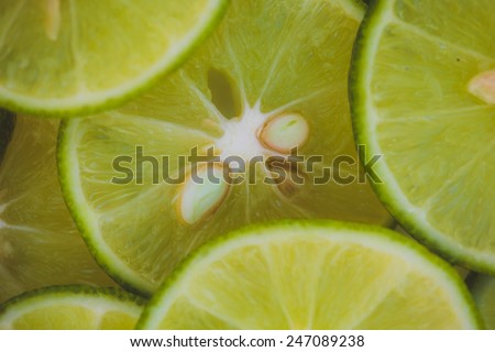 Lime slices background in green
