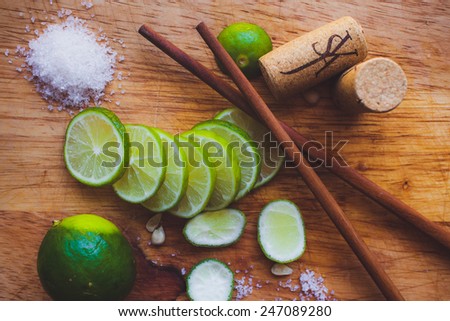 Lime slices, sugar, cork and Chinese sticks