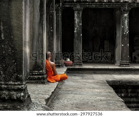 A monk meditates at the Angkor Wat temple in Siem Reap Cambodia.