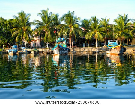Tourist boats in Hoi An Vietnam on a beautiful clear morning. This is an editorial photo taken July 12th, 2015 in Hoi An Vietnam.