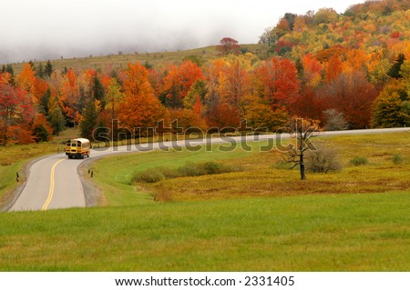 Autumn School Bus on Mountain Road