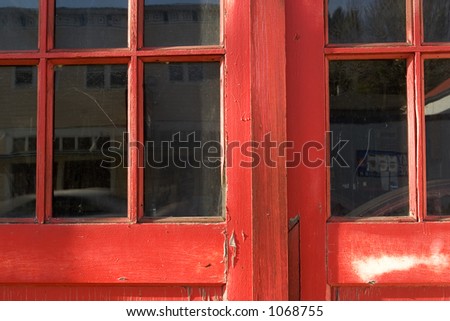 Photo of a  antique Red Door with paned windows