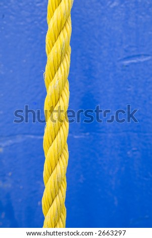 Yellow rope on blue background.