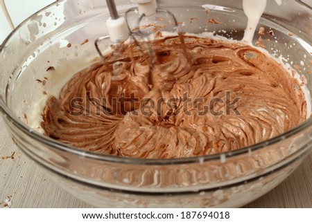 Making filling. Add chocolate mixture into whipped cream until just combined. Making Chocolate Hazelnut Meringue Cake