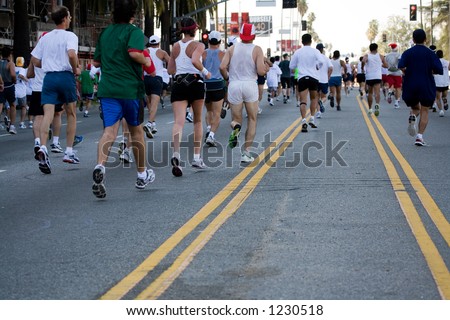 People running on the street in the urban marathon event.
