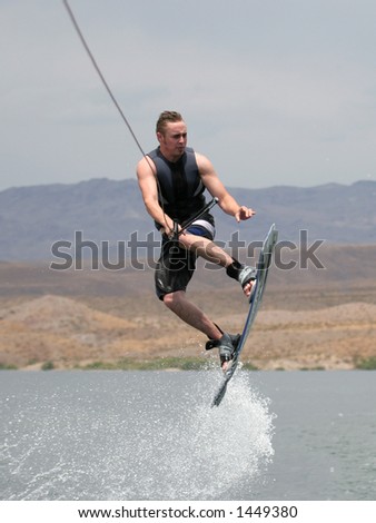 Young Man Catching Air on Wakeboard