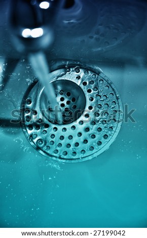 Water dripping from water tap , retro style toned photo with shallow DOF