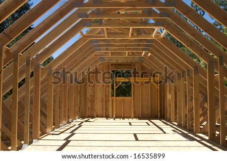 The roof truss system over a garage for a house under construction