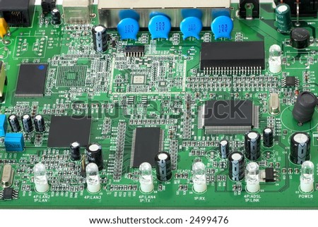 Close up view of a modern printed circuit board showing various electronic components and connectors