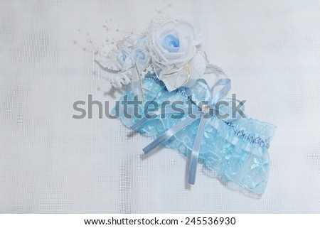 Blue Wedding Garter; a set of of a wedding garter and a buttonhole