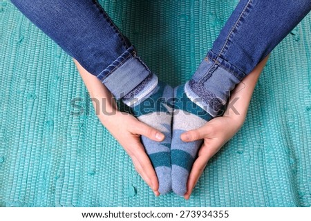 Feet, Ankles and Hands/hands folding feet in socks