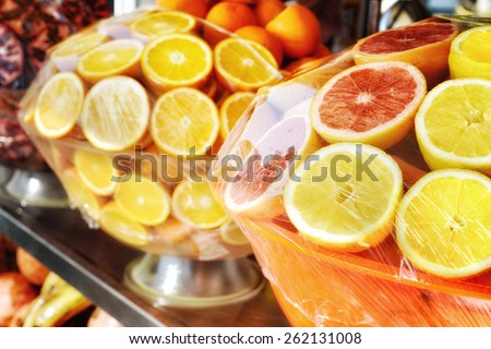 Closeup of fresh fruits. Shop with fresh fruits juices.