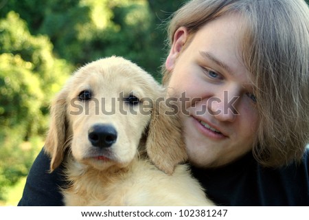 Teen Boy And Golden Puppy 2
