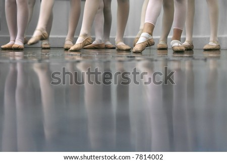 Young dancers... low angle shot of just feet and legs - this view has had the color removed from the floor and wall.