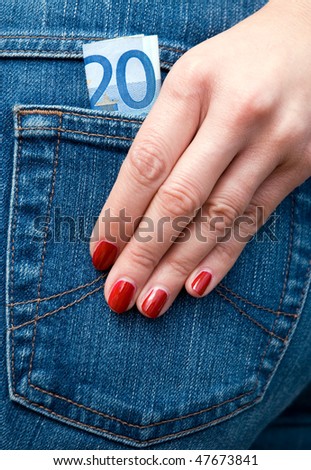 Woman and and pocket money in jeans