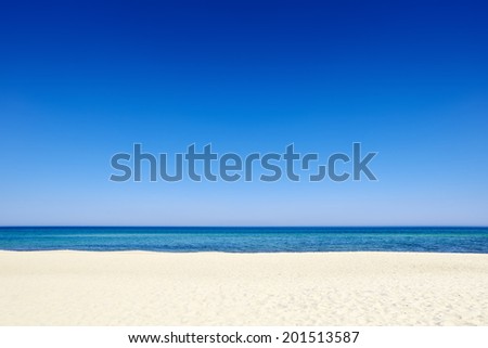 Clear sunny summer blue sky sea coast beach sand background copyspace.