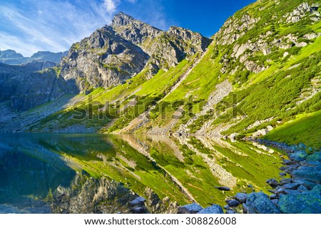 Beautiful nature landscape Gasienica Black Pond lake High Tatra Mountains Carpathians, Poland.