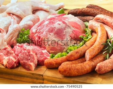 Sausages and meat on a cutting board