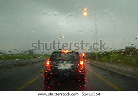 stopped at traffic lights the car in the rain