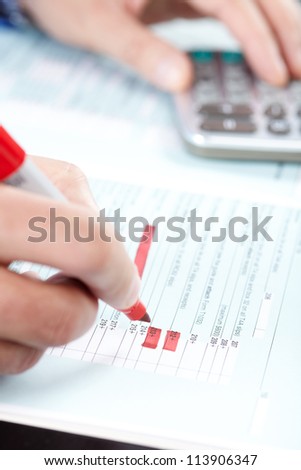 The businessman at office works with the documents