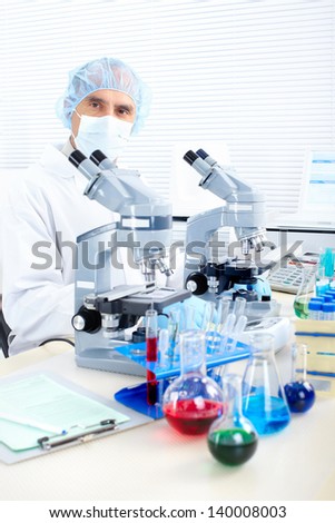Science team working with microscopes in a laboratory